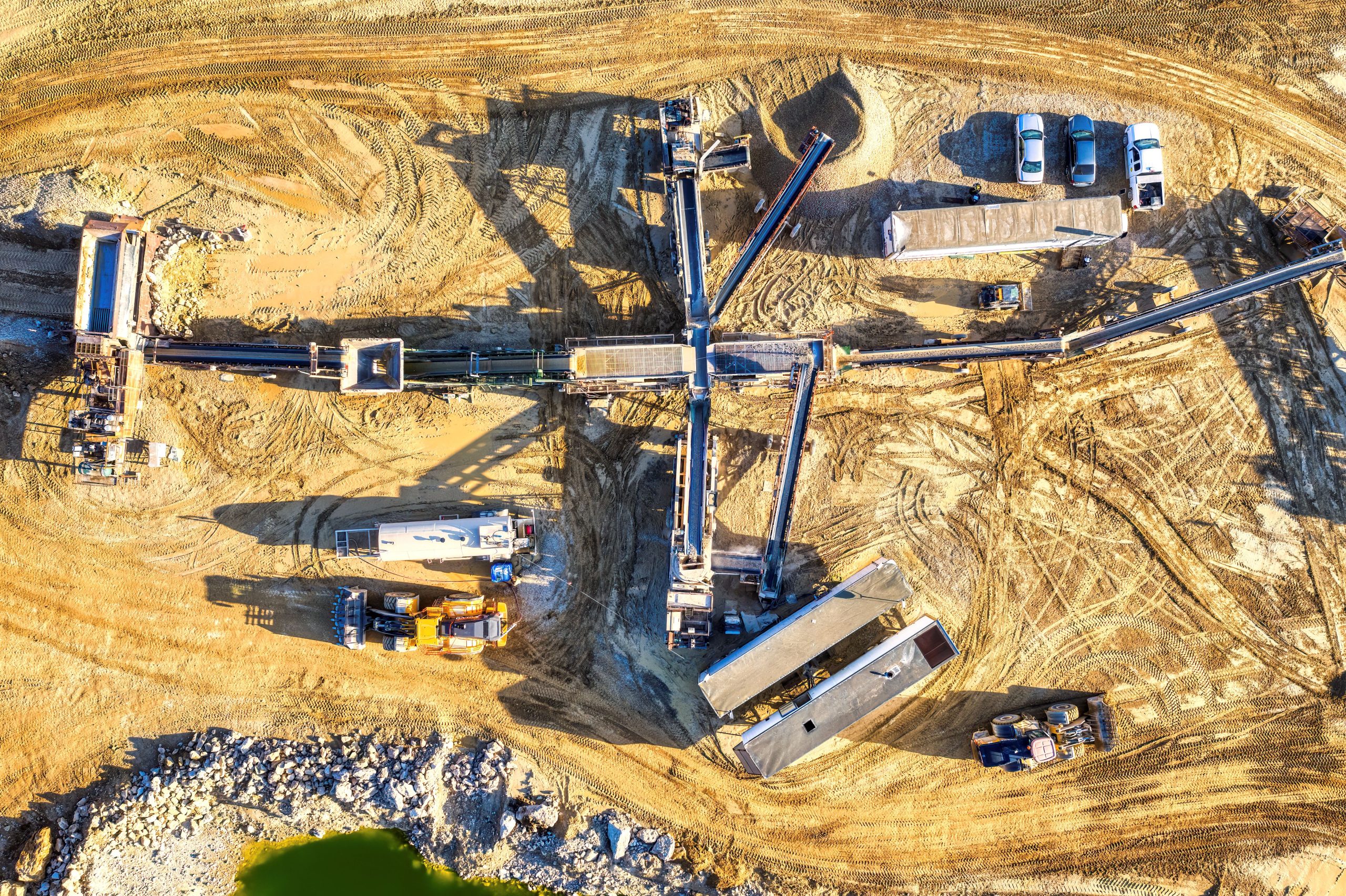 Drone capture of an industrial mining site in Rochester, showcasing heavy machinery and equipment.